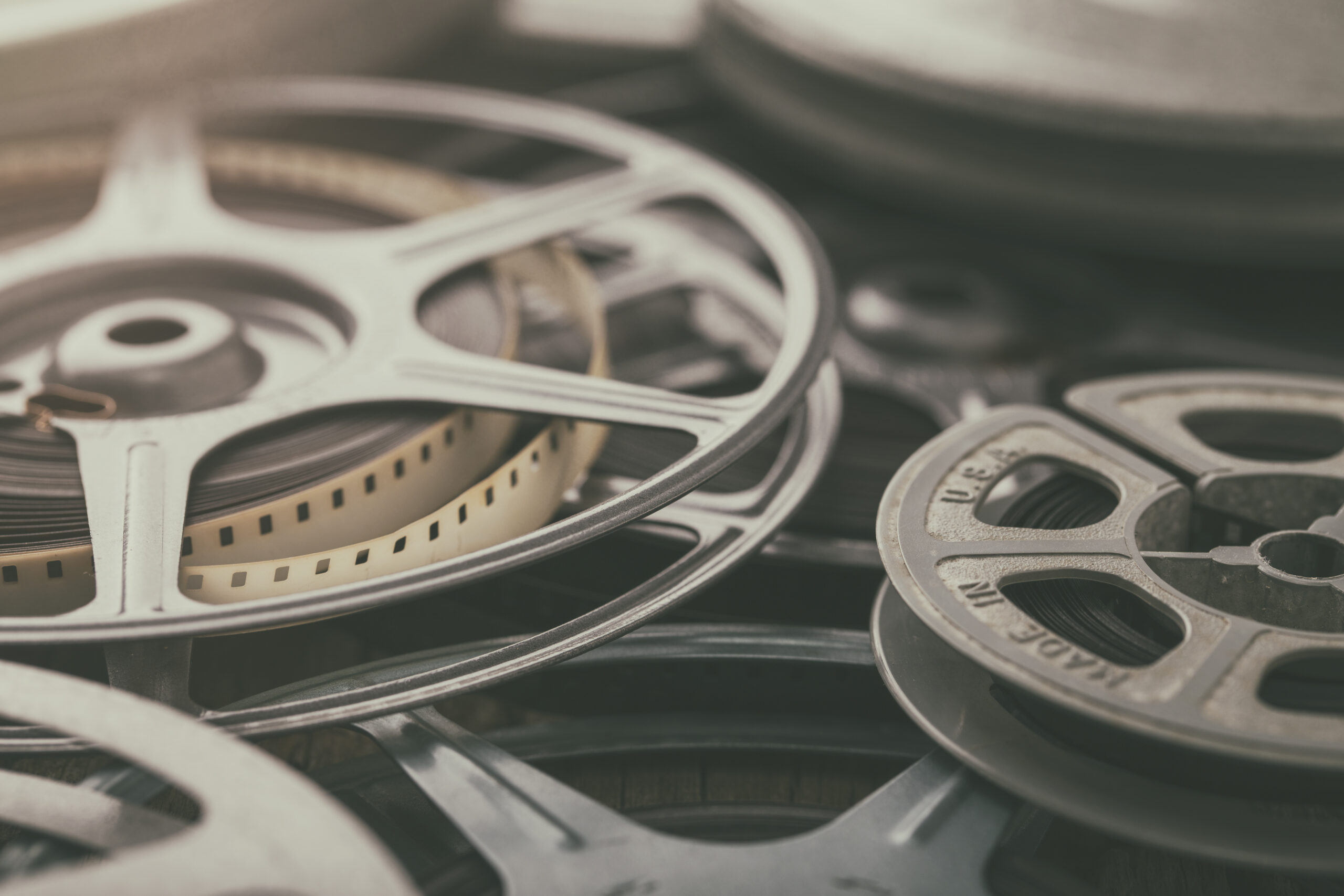 Vintage 8mm Film Reels of Home Movies History and Memories Vintage 8mm home movies on film reels with film leaders and spools.